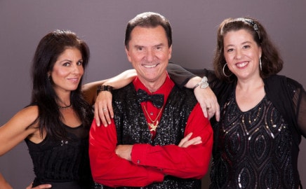 Dan Damon with performers — a full stage show experience.